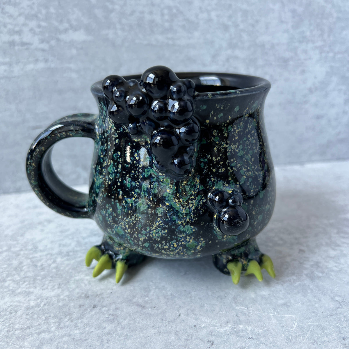 Cauldron Mug Speckled with Green Claws