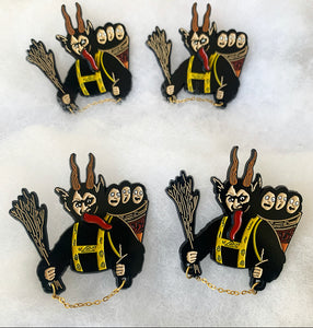 Krampus 2" Soft Enamel Pin with Spinner tongue and attached chain.